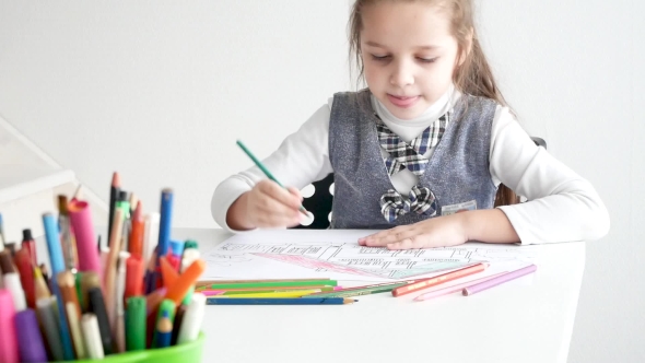 Little Girl Drawing a Picture on White Room 7 Years Old Girl Drawing and Coloring on a Paper at