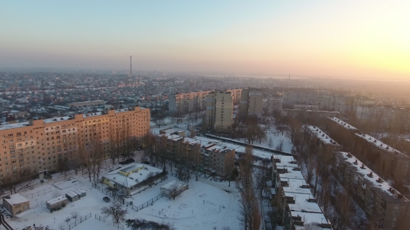 Aerial Shot of a City Block with Multistoreyed Buildings at Sunset in Winter