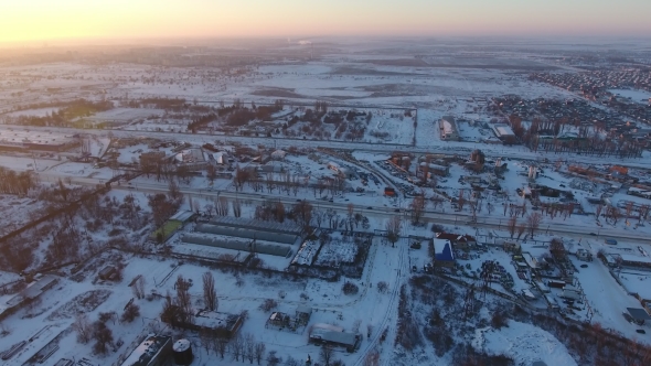 Aerial Shot of a City Infrastructure with Buildings, Roads and Parks in Winter