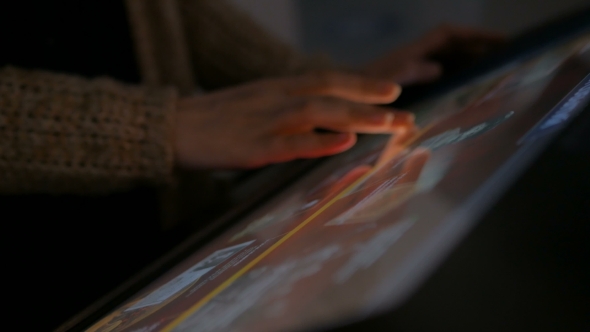 Woman Using Interactive Touchscreen Display
