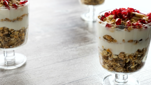 Delicious Home Made Muesli with Natural Yogurt and Pomegranate alt