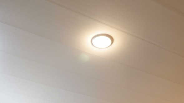 Shutdown Energy Saving Lamp on the Ceiling in the Room