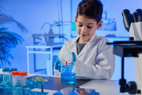 Schoolboy using lab equipment, laboratory education concept Stock Photo ...