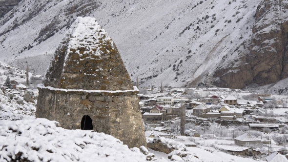 Tomb in the Background of a Mountain Village