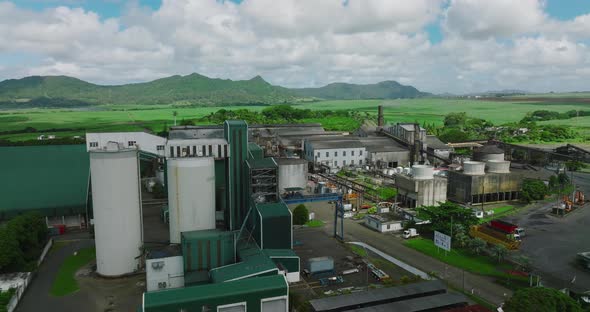 Aerial View of Sugar Factory in Green Sugarcane Fields on Mauritius Island alt