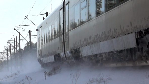 Passing Train in the Winter. Snowy Turbulence