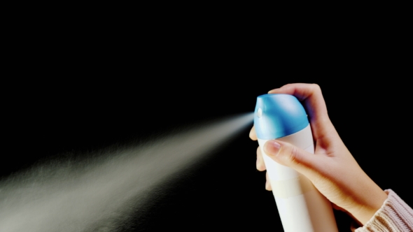 Hand with an Aerosol Can. Spray Spray on a Black Background, Stock Footage