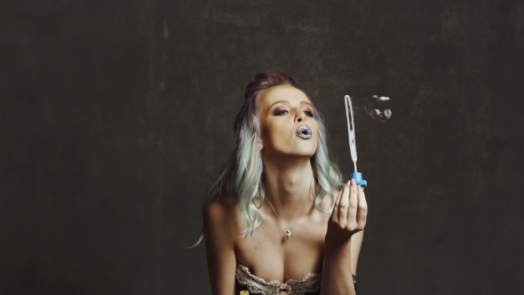 Woman Blowing Soap Bubbles alt