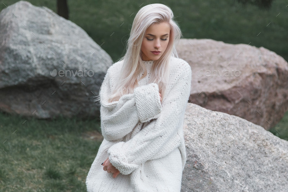 Blonde Hair Beautiful Female Wearing In Knitted White Sweater