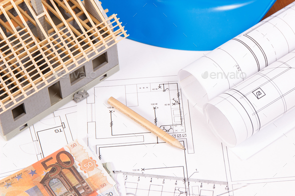 Currencies euro, electrical diagrams, accessories for engineer jobs and house under construction Stock Photo by ratmaner