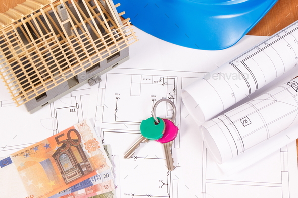 Currencies euro, home keys, electrical diagrams for engineer jobs and house under construction Stock Photo by ratmaner