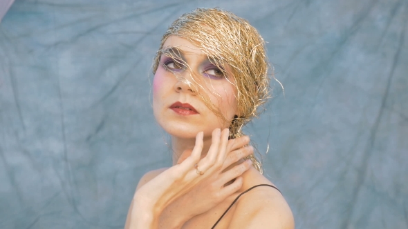 Portrait of a Beautiful Young Woman in a Vintage Image. She Participates in the Photo Shoot.