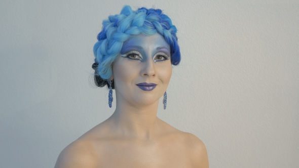 Portrait of a Beautiful Young Woman in a Magical Image. She Participates in the Photo Shoot.