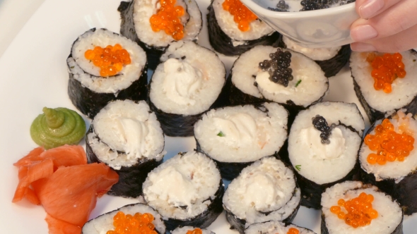 Decorate Sushi Rolls with Black Caviar