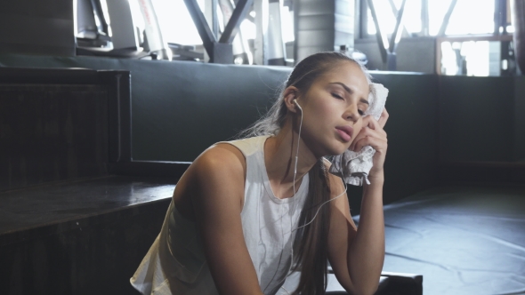 Beautiful Sexy Sportswoman Wiping Her Face Sensually After Workout alt