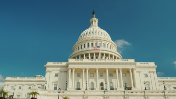 The Majestic Famous Capitol Building in Washington, DC. Against the Background of the Blue Sky alt