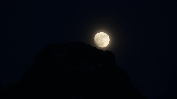 Moon Over a Rock in the Night