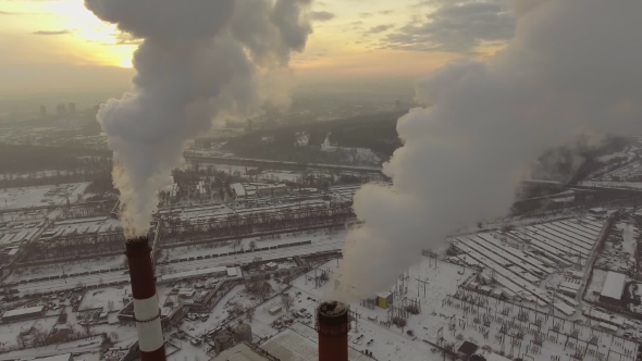 Aerial View of a Tube with Smoke at Winter Sunset