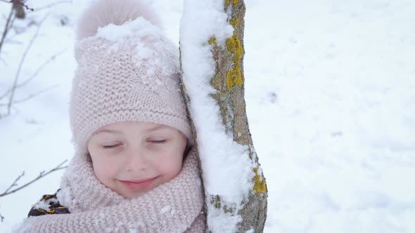 Child By Snowy Tree alt