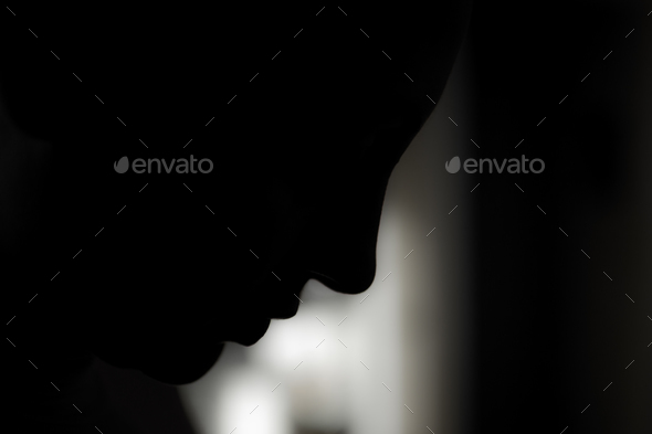 Face in shadow - Stock Photo - Images