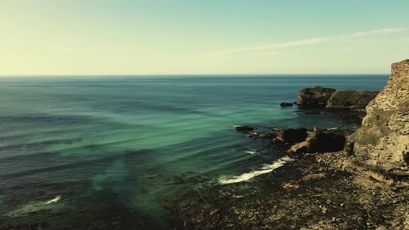 Seascape of the Atlantic Ocean bay with rocks above the water. Aerial view.