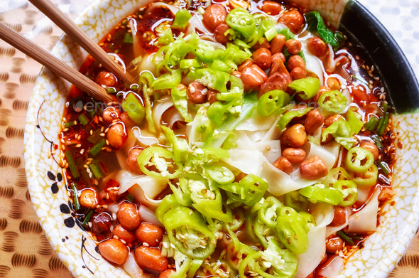 Spicy noodle soup popular in Yunnan Province, China. Stock Photo by Maciejbledowski