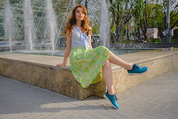 Beautiful girl sitting near fountain Stock Photo by arthurhidden | PhotoDune