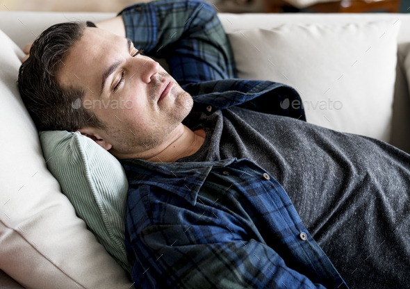 Caucasian man sleeping on the couch Stock Photo by Rawpixel | PhotoDune