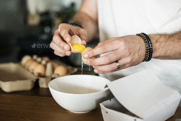 Closeup of man separating egg yolk Stock Photo by Rawpixel | PhotoDune