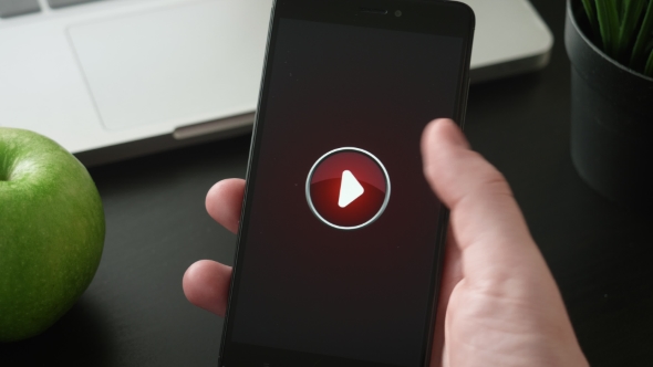 Pressing Play Button on the Smartphone