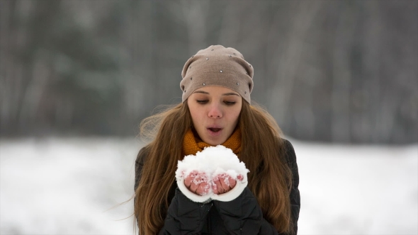 Pretty Girl Blowing on Snow. Lady Throws Snow Up, Stock Footage | VideoHive