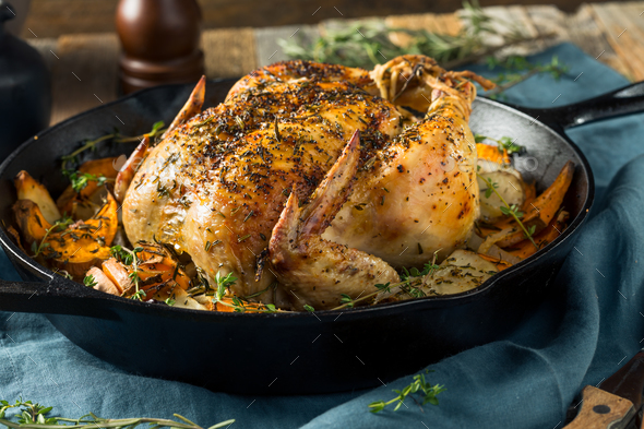Herby Homemade Rustic Whole Skillet Chicken Stock Photo by bhofack2