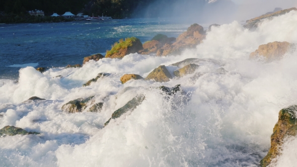 Stream of Water Is Broken Against the Stones at the Foot of Niagara Falls alt