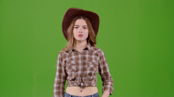 Cowboy Girl Is Showing Her Finger Down. Green Screen alt