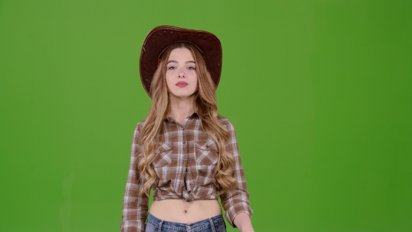 Cowboy Girl in a Hat Shows a Thumbs Up. Green Screen alt