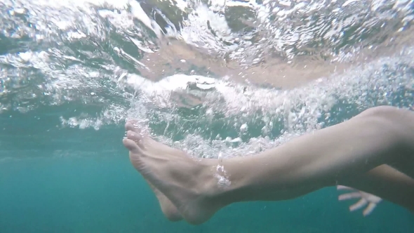 Beautiful Female Feet Falling Underwater.  with Bubbles, Holidays Summer Fun