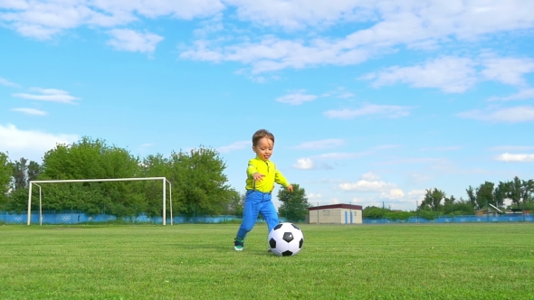 Boy Child Kicks A Soccer Ball On The Background Of A Football Goal By Julia Diak