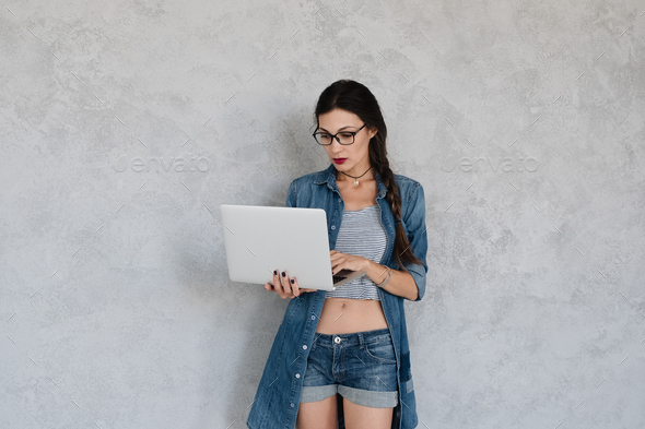 Girl focused on laptop screen - Stock Photo - Images