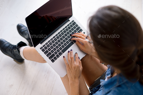 Close-up portrait of womans hands on touchpad - Stock Photo - Images
