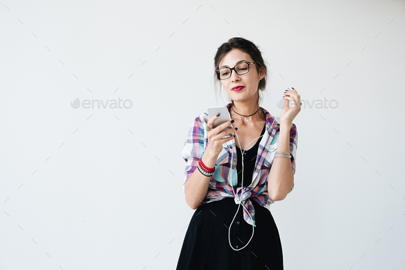 Girl putting on her earphones Stock Photo by arthurhidden | PhotoDune