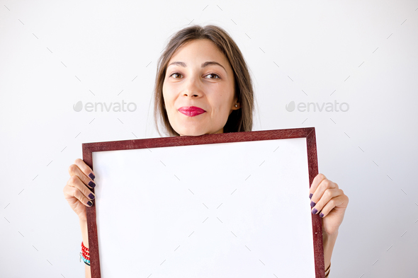 Close-up smiling girl with a display near face - Stock Photo - Images