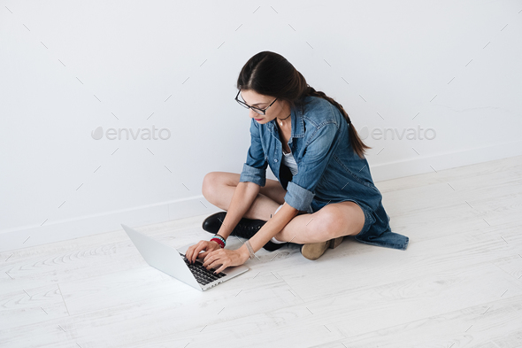 Woman working on a laptop on a laptop - Stock Photo - Images