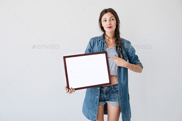 Woman with advertising frame - Stock Photo - Images