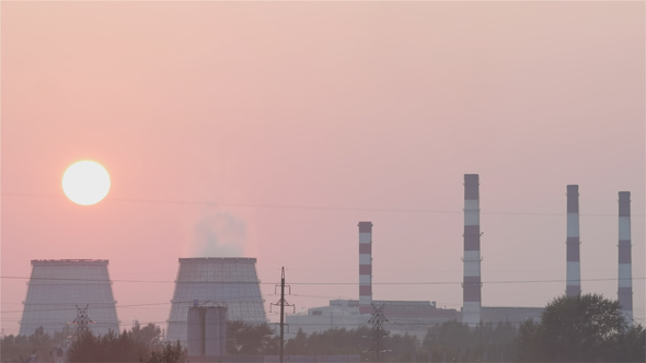 Sunset over the Thermal Power Plant in the Smog alt