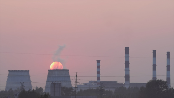 Sun in the Smoke of the Thermal Power Plant alt