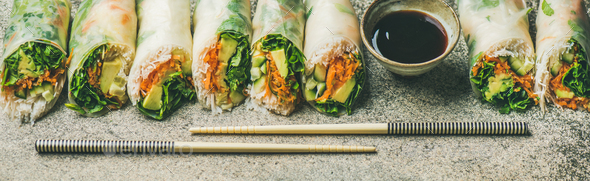 Vegan spring rice paper rolls over concrete background - Stock Photo - Images