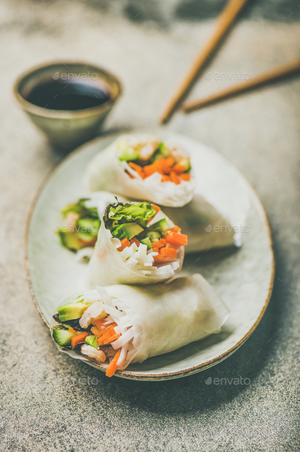 Shrimp and vegetable rice paper spring rolls on ceramic plate - Stock Photo - Images