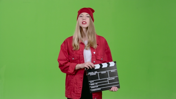 Assistant of the Operator Does the Cotton Clapperboard and Leaves the Site. Green Screen alt