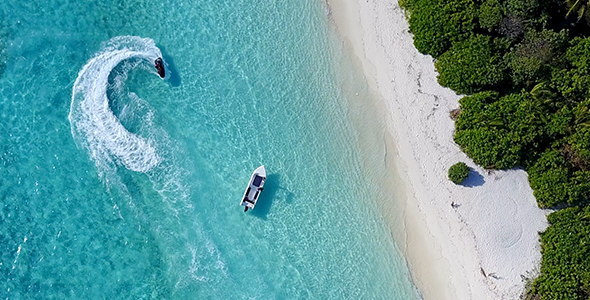 Jet Ski Spinning Next to a Tropical Island