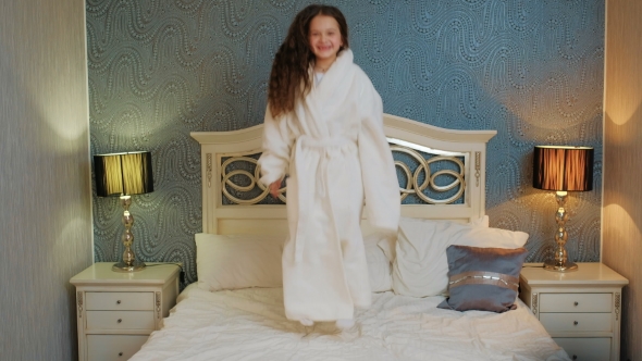 Child Bedtime Happy Joyful Girl Jumping Bed alt